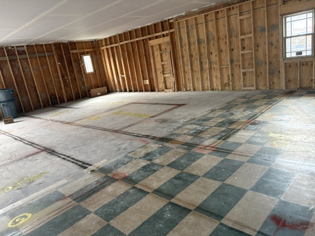 New ceiling with rooms and plumbing marked on the floor