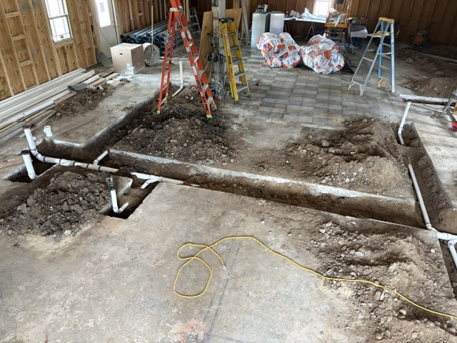 Plumbing being added to the trenches